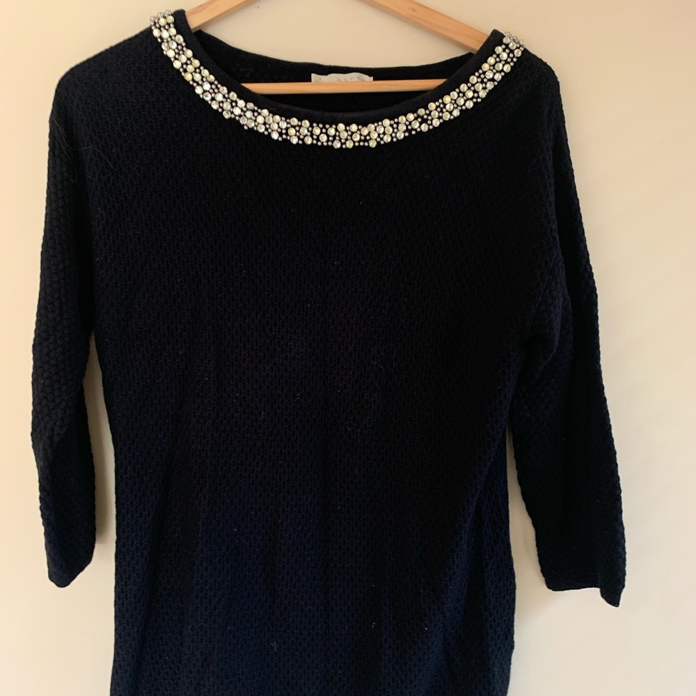 Subtle open back sweater with beaded neckline